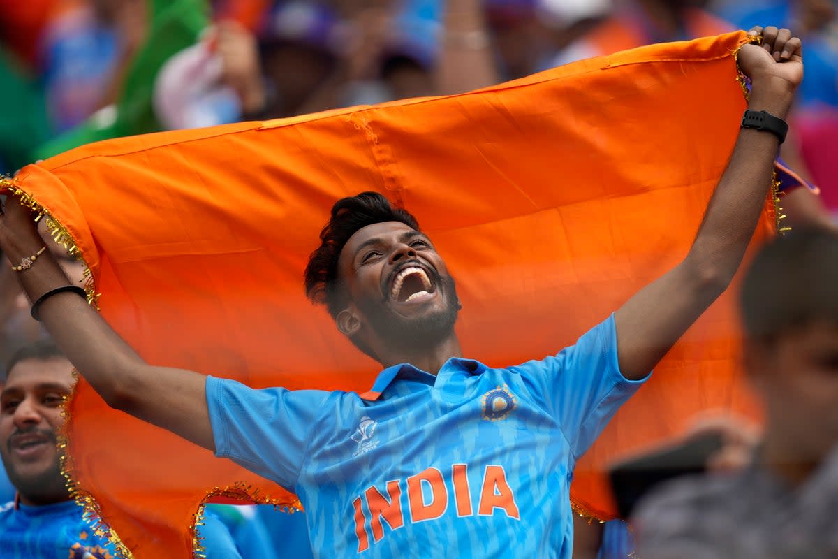 A fan cheers for the Indian cricket team before the start of ICC Men's Cricket World Cup match between India and Pakistan (AP)