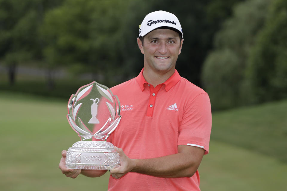 Jon Rahm, of Spain, poses with the trophy after winning the Memorial golf tournament, Sunday, July 19, 2020, in Dublin, Ohio. (AP Photo/Darron Cummings)