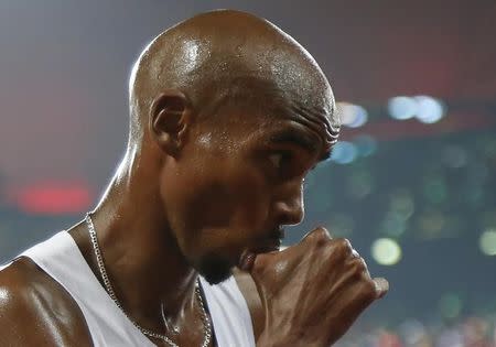 Mo Farah of Britain reacts after winning the men's 5000m event during the 15th IAAF World Championships at the National Stadium in Beijing, China August 29, 2015. REUTERS/Lucy Nicholson