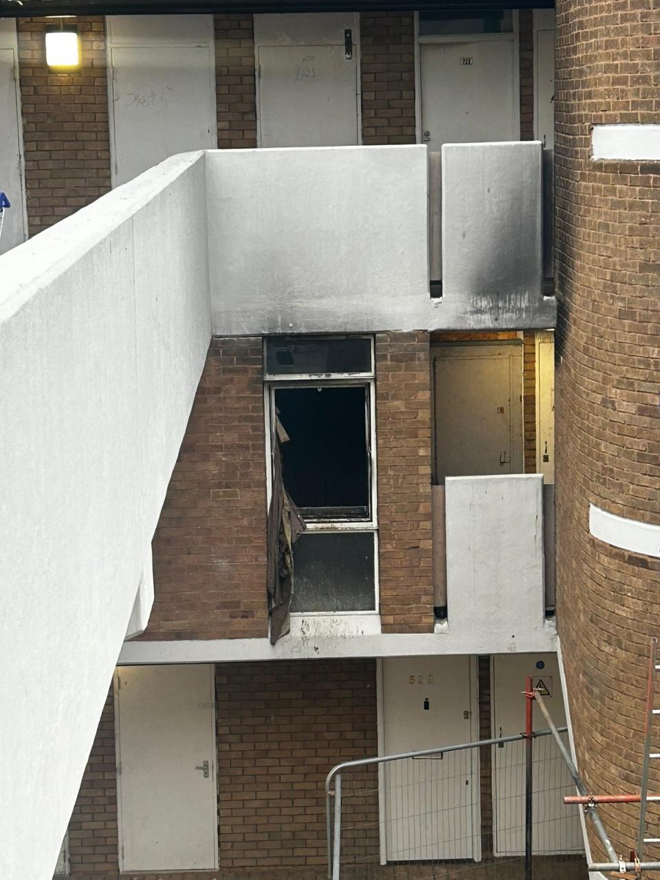 One flat has been left burnt out inside the estate (The Independent)