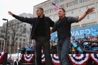 MADISON, WI - NOVEMBER 05: U.S. President Barack Obama and rocker Bruce Springsteen wave to a crowd of 18,000 people during a rally on the last day of campaigning in the general election November 5, 2012 in Madison, Wisconsin. Obama and his opponent, Republican presidential nominee and former Massachusetts Gov. Mitt Romney are stumping from one 'swing state' to the next in a last-minute rush to persuade undecided voters. (Photo by Chip Somodevilla/Getty Images)