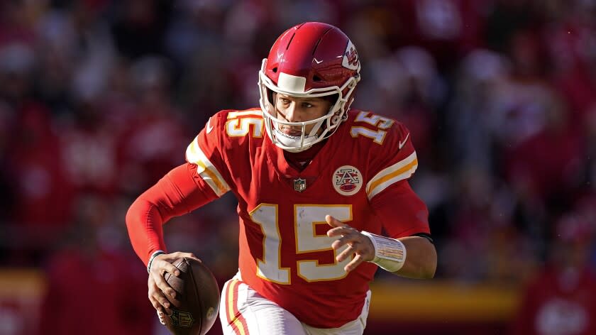 Kansas City Chiefs quarterback Patrick Mahomes looks to pass during the second half of an NFL football game.