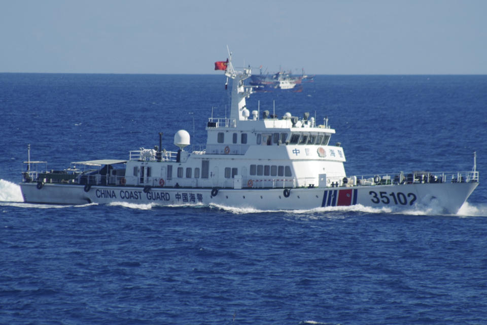 FILE - In this Aug. 6, 2016, file photo released by the 11th Regional Coast Guard Headquarters of Japan, a Chinese coast guard vessel sails near disputed East China Sea islands. China claims almost all of the South China Sea, has built military bases on artificial islands in the disputed area and routinely objects to any action by the U.S. military in the region. (11th Regional Coast Guard Headquarters via AP, File)