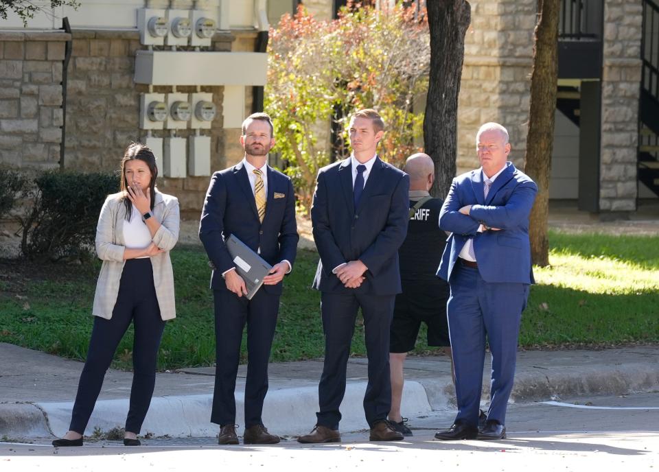 Austin police officer Christopher Taylor, second from right, with his attorneys, left to right, Lindsey Adams, Ken Ervin and Doug O’Connell watch on Nov. 7 as jurors look at the apartment complex parking lot on South Pleasant Valley Road where Taylor shot Michael Ramos in 2020.