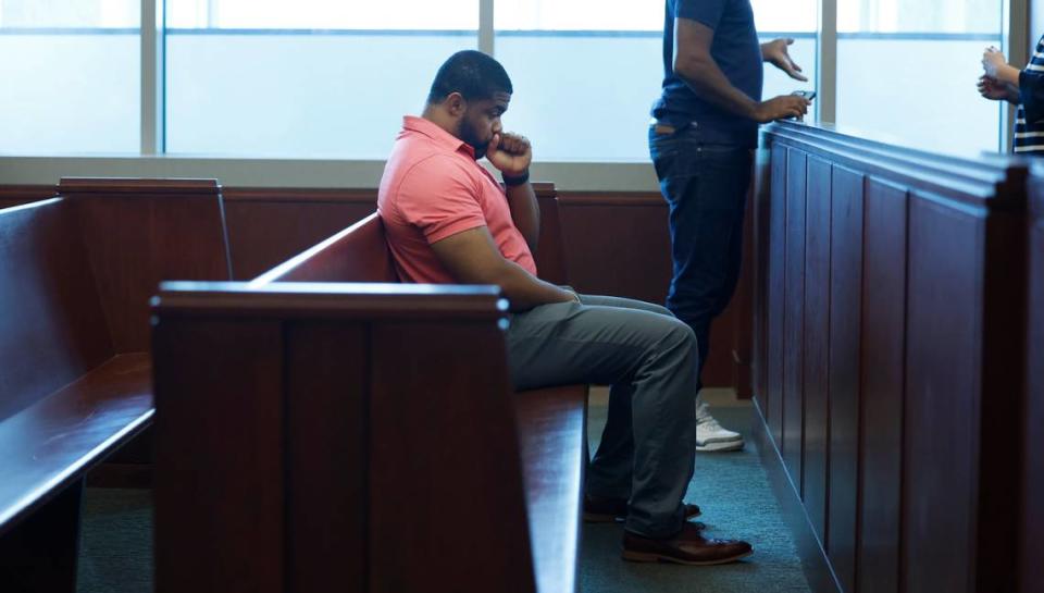 Kevin Spruill awaits a dismissal in his case in the gallery of a Wake County courtroom Aug. 24.