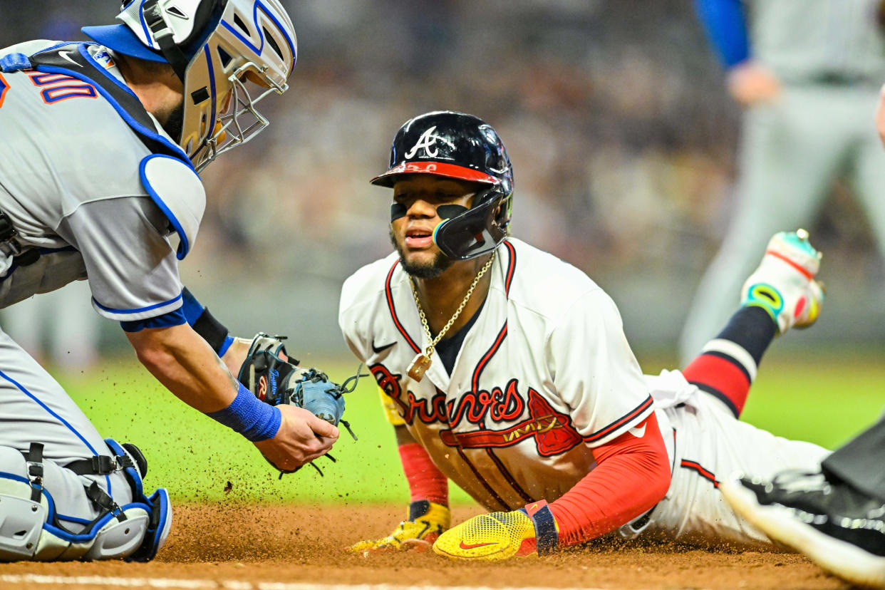 Atlanta Braves outfielder Ronald Acuna Jr. (13) is tagged out by New York Mets catcher Tomas Nido (3) during a game on Saturday, Oct. 1st, 2022 at Truist Park in Atlanta, GA. (Rich von Biberstein/Icon Sportswire via Getty Images)