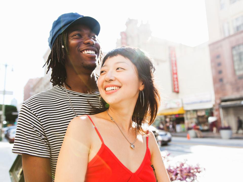 A young couple in a city street.