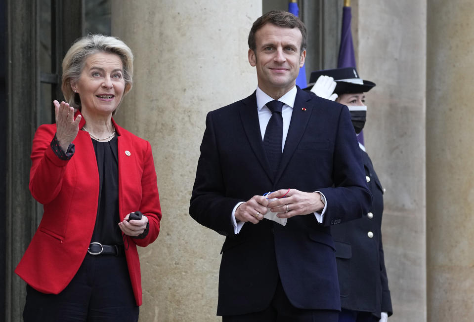 French President Emmanuel Macron, right, greets European Commission President Ursula von der Leyen on the steps of the Elysee Palace in Paris, France, Friday, Jan. 7, 2022. France took over the helm of the six month presidency of the Council of the European Union on Jan. 1, 2022. (AP Photo/Michel Euler, Pool)