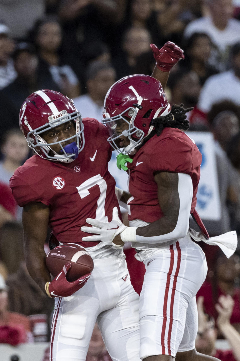 Alabama wide receiver Ja'Corey Brooks (7) celebrates with running back Jahmyr Gibbs (1) after Brooks' touchdown against Vanderbilt during the first half of an NCAA college football game Saturday, Sept. 24, 2022, in Tuscaloosa, Ala. (AP Photo/Vasha Hunt)