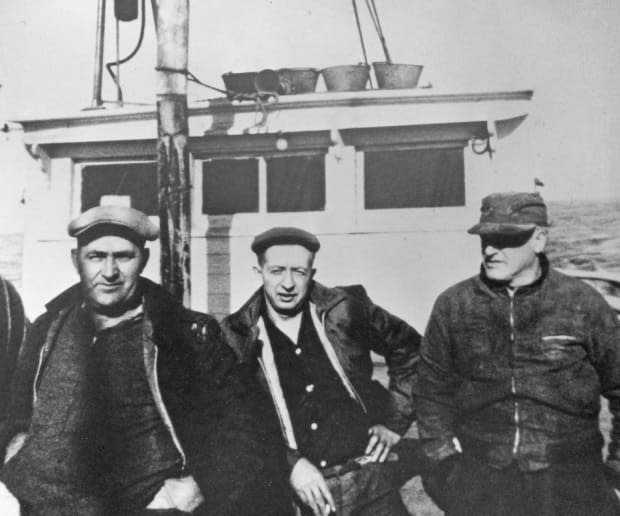 Captain Harvey Banfield, left, and his crew, who delivered the Dunton to her new owners at Mystic in 1963.