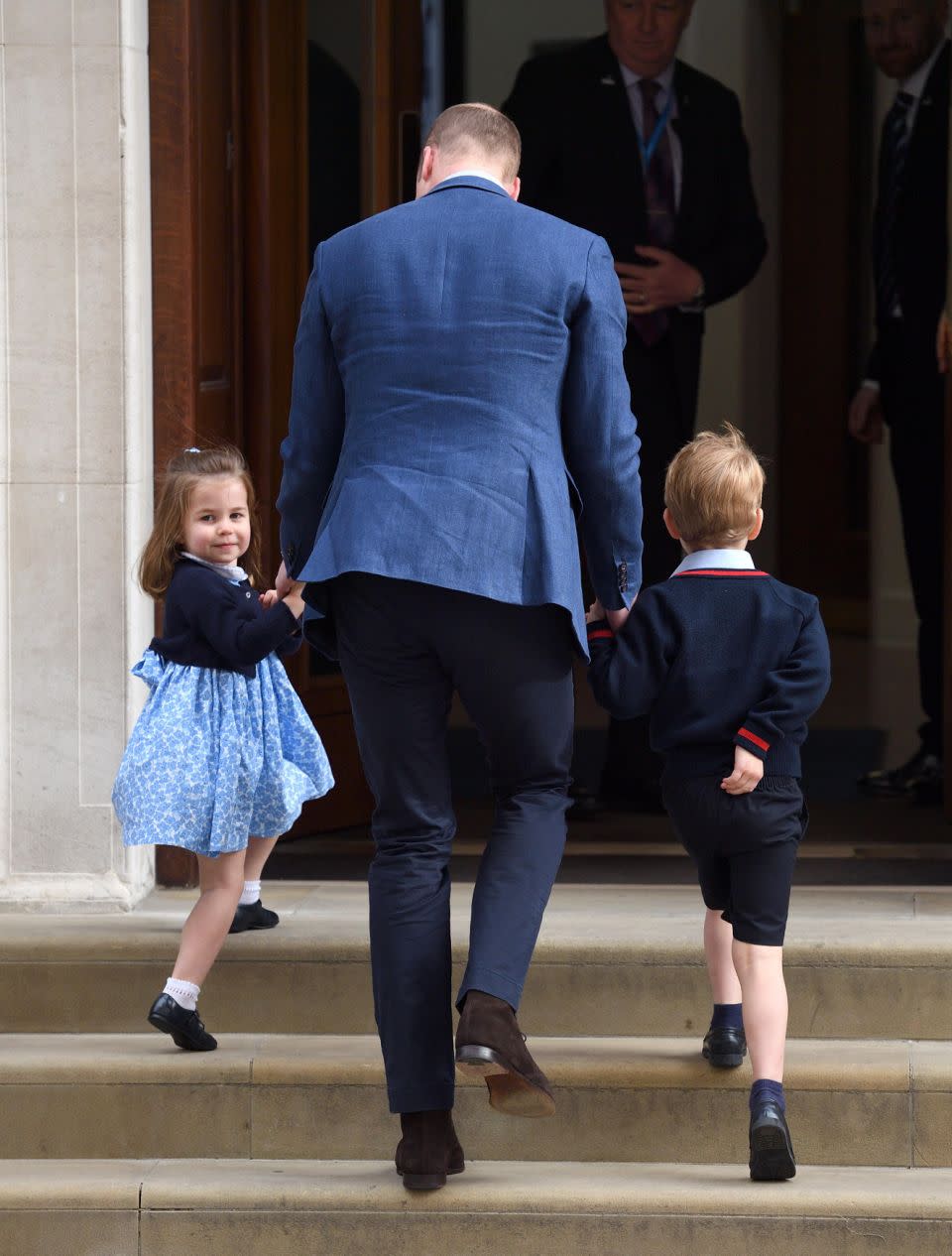 Unlike her camera-shy brother, Charlotte happily waved to crowds. Photo: Getty