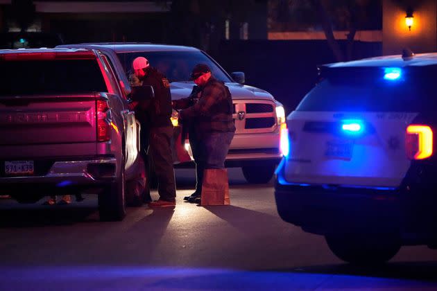 Las Vegas police work near the North Las Vegas home of former actor Nathan Chasing Horse during a raid.