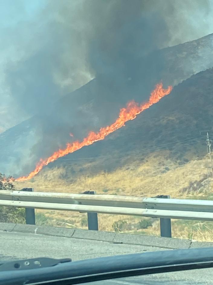 A brush fire along Interstate 5 near Castaic Wednesday afternoon closed the Grapevine in both directions into Wednesday night.