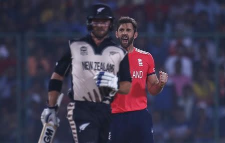 Cricket - England v New Zealand - World Twenty20 cricket tournament semi-final - New Delhi, India - 30/03/2016. England's Liam Plunkett (R) celebrates taking the wicket of New Zealand's Colin Munro. REUTERS/Adnan Abidi