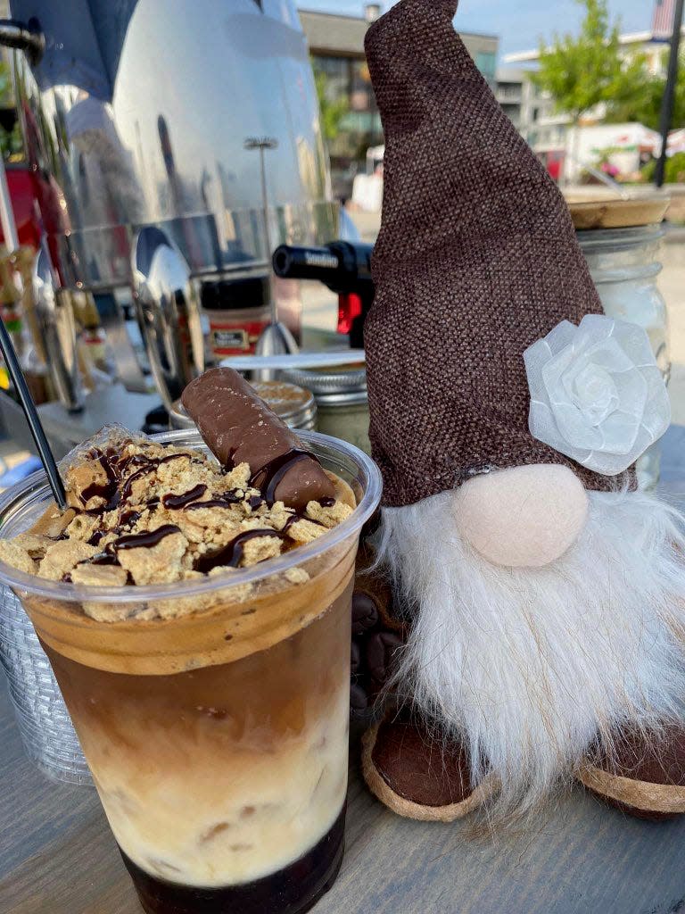Coffee in a Cloud offered a Twix latte, topped with a Twix candy bar, as its Flavor of the Week in June 2023. The mobile coffee stand's unique coffee drinks are made with cold brew, oat milk and whipped coffee, plus other syrups and toppings for specialty lattes.