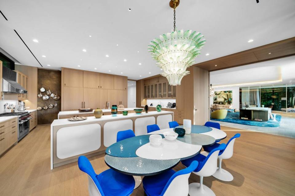 Above: A look inside the home’s kitchen, which overlooks the backyard and, in the distance, the bay.