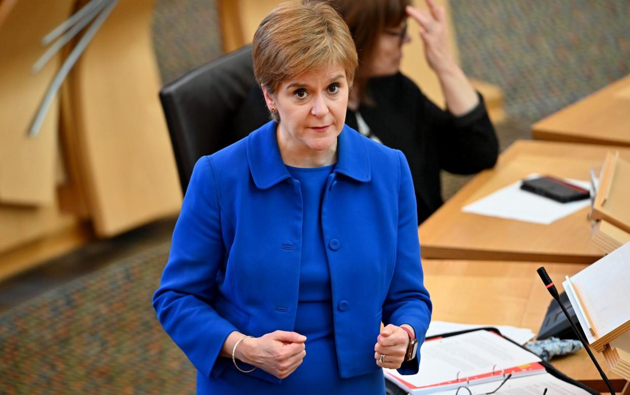 First Minister Nicola Sturgeon announces her plans to halt the spread of coronavirus at the Scottish Parliament - Getty Images Europe