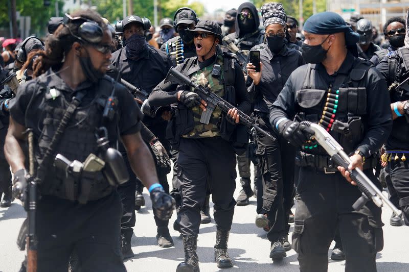 Members and supporters of an all-Black militia group called NFAC hold an armed rally in Louisville