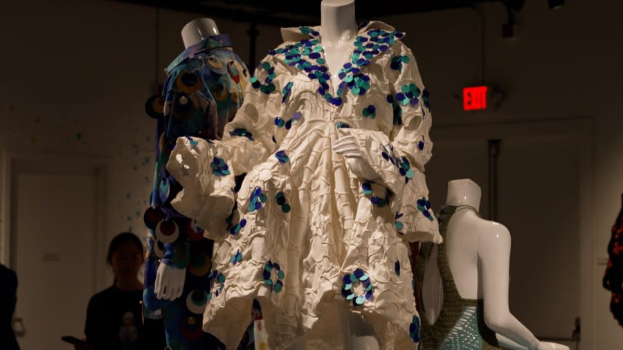 Using a new type of sequin, designers are able to create sustainable fashion at the Particles of Color exhibit. (Credit: Eric Henrikson/KXAN)