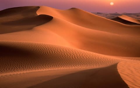 Dubai is surrounded by desert - Credit: getty