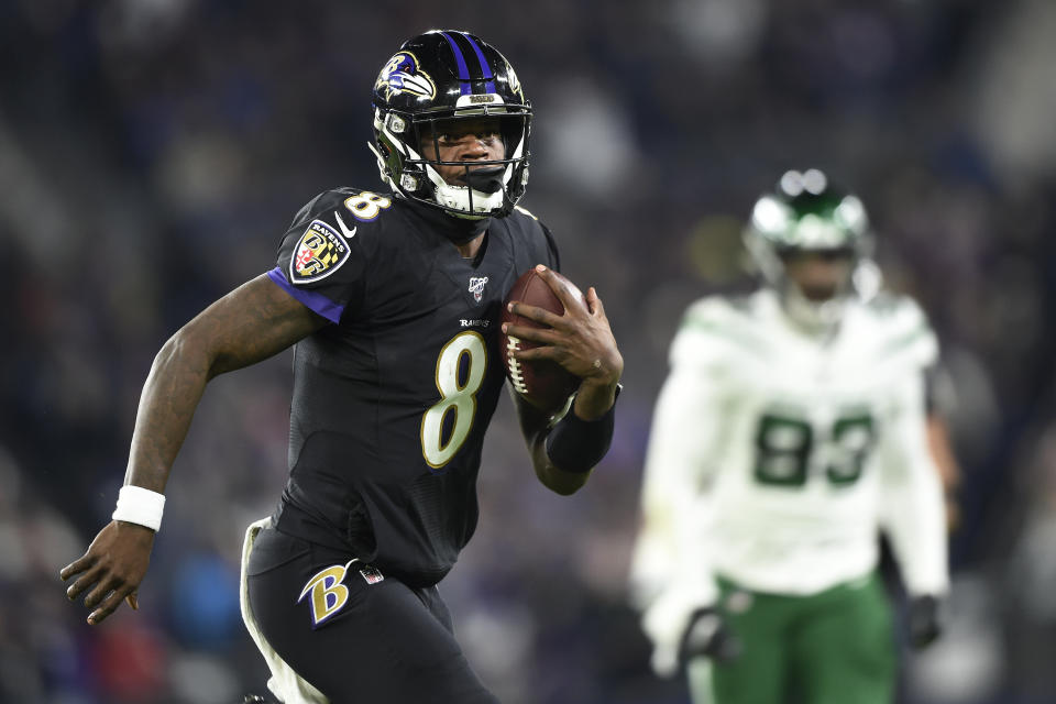 Baltimore Ravens quarterback Lamar Jackson (8) scrambles for yardage against the New York Jets during the first half of an NFL football game, Thursday, Dec. 12, 2019, in Baltimore. (AP Photo/Gail Burton)