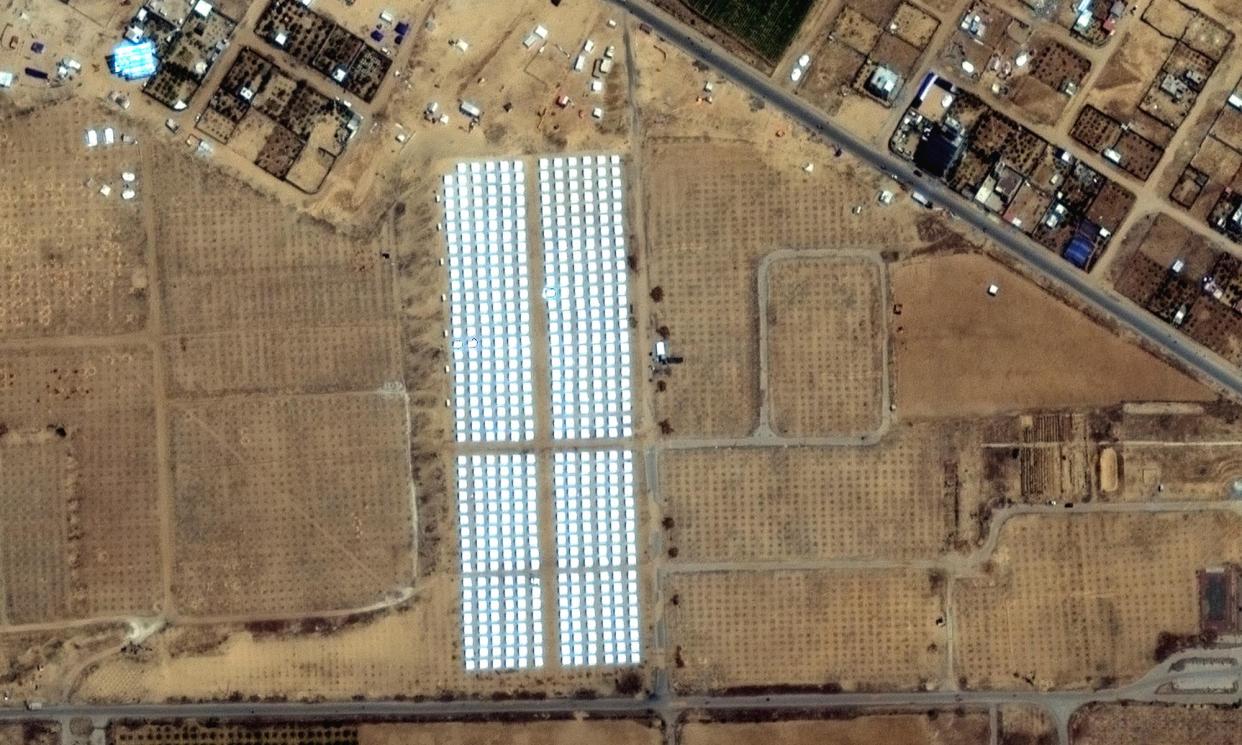 <span>A satellite image shows rows of tents have been put up near Khan Younis, roughly three miles north of Rafah, which are thought to be for a mass evacuation.</span><span>Photograph: Maxar Technologies/AP</span>