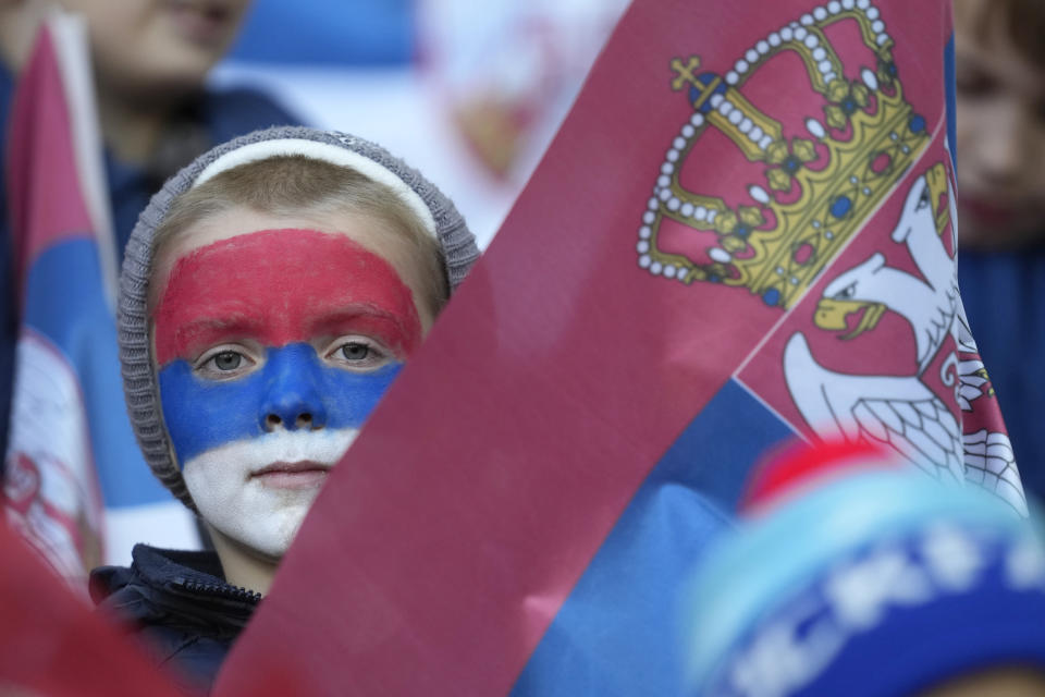 Serbian fans wait for start of the Euro 2024 group G qualifying soccer match between Serbia and Bulgaria at the Dubocica stadium in Leskovac, Serbia, Sunday, Nov. 19, 2023. (AP Photo/Darko Vojinovic)