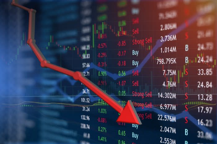 Stock market data with a red arrow chart indicating losses.