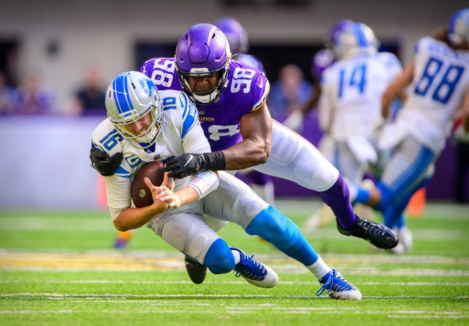 Vikings defensive end D.J. Wonnum (98) brings down Lions quarterback Jared Goff (16) for a sack during last Sunday's game.