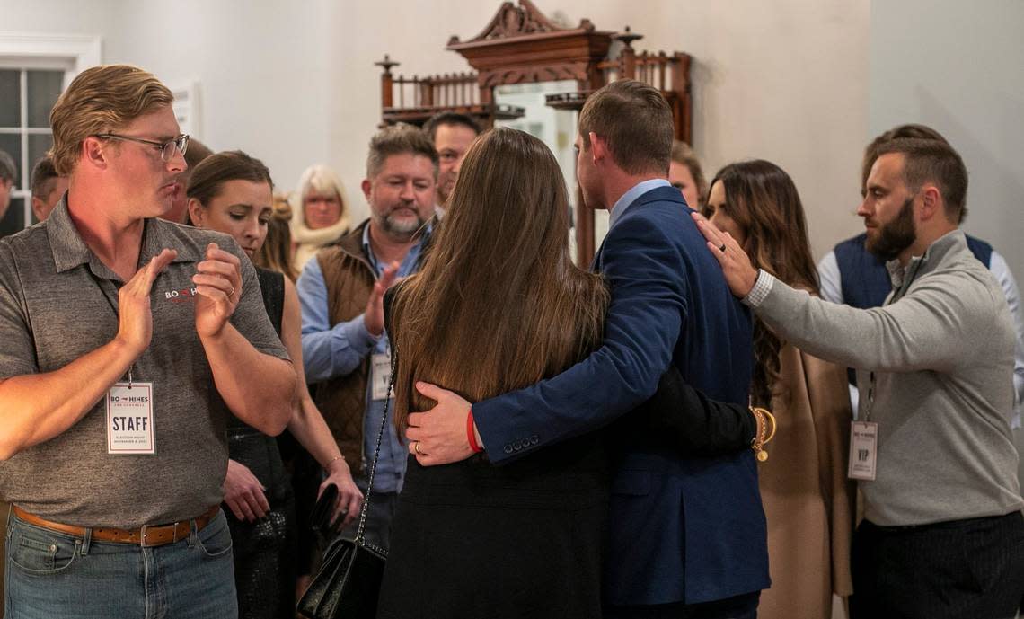 Bo Hines, candidate for the US House District 13, is consoled by his supporters after conceding to opponent Wiley Nickel at the Norris House on Tuesday, November 8, 2022 in Raleigh, N.C.