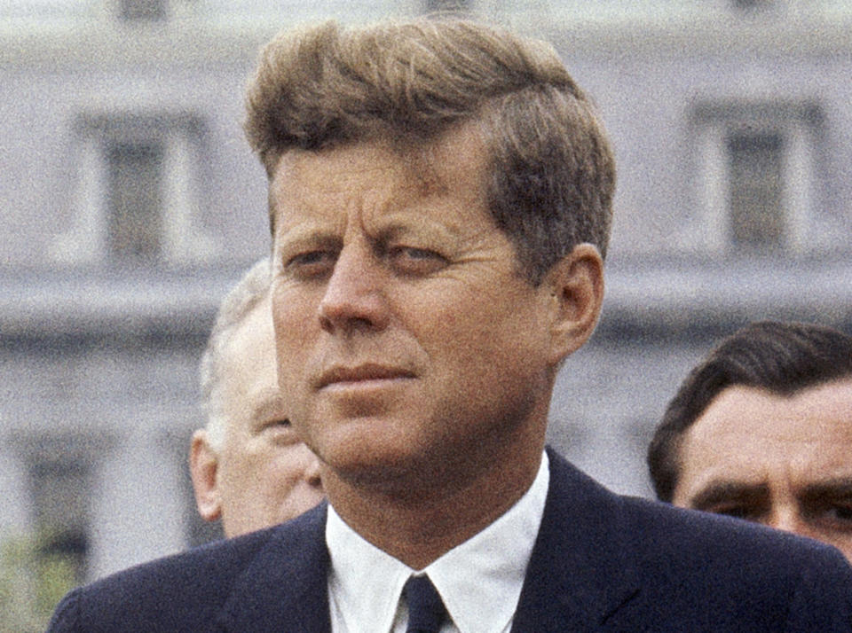 FILE - President John F. Kennedy listens while Grand Duchess Charlotte of Luxembourg speaks outside the White House, April 30, 1963, in Washington. The 60th anniversary of President Kennedy's assassination, marked on Wednesday, Nov. 22, 2023, finds his family, and the country, at a moment many would not have imagined in JFK's lifetime. (AP Photo/William J. Smith, File)