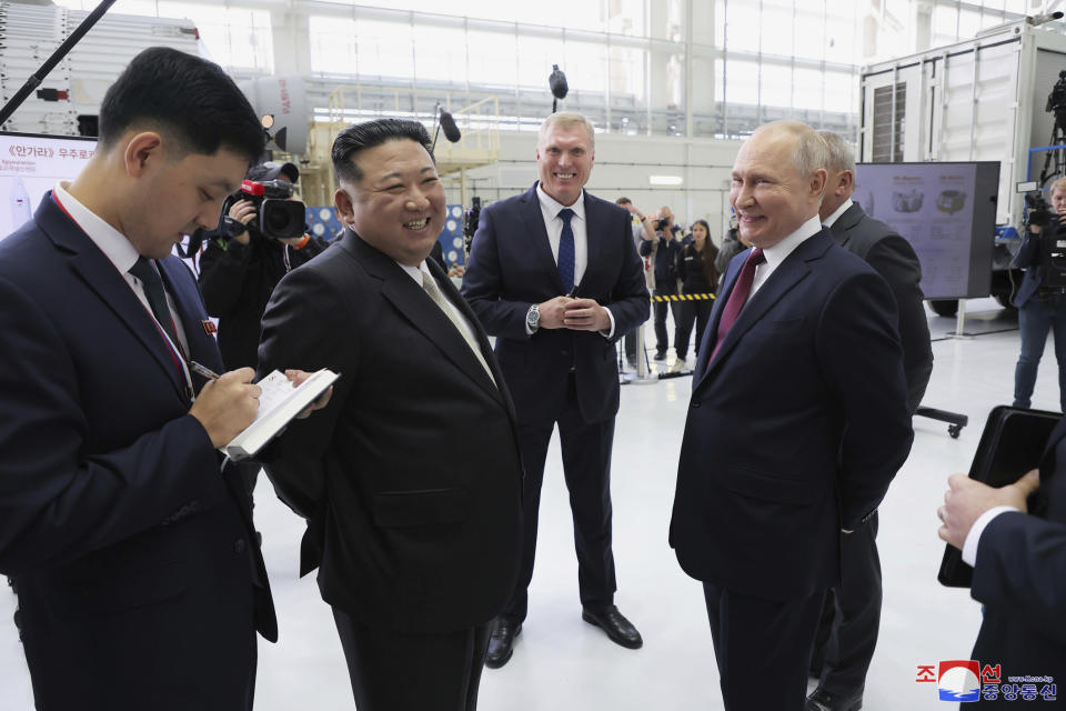 In this photo provided by the North Korean government, Russian President Vladimir Putin, right, and North Korean leader Kim Jong Un visit the Vostochny cosmodrome outside the city of Tsiolkovsky, about 200 kilometers (125 miles) from the city of Blagoveshchensk in the far eastern Amur region, Russia, Wednesday, Sept. 13, 2023. Independent journalists were not given access to cover the event depicted in this image distributed by the North Korean government. The content of this image is as provided and cannot be independently verified. Korean language watermark on image as provided by source reads: "KCNA" which is the abbreviation for Korean Central News Agency. (Korean Central News Agency/Korea News Service via AP)