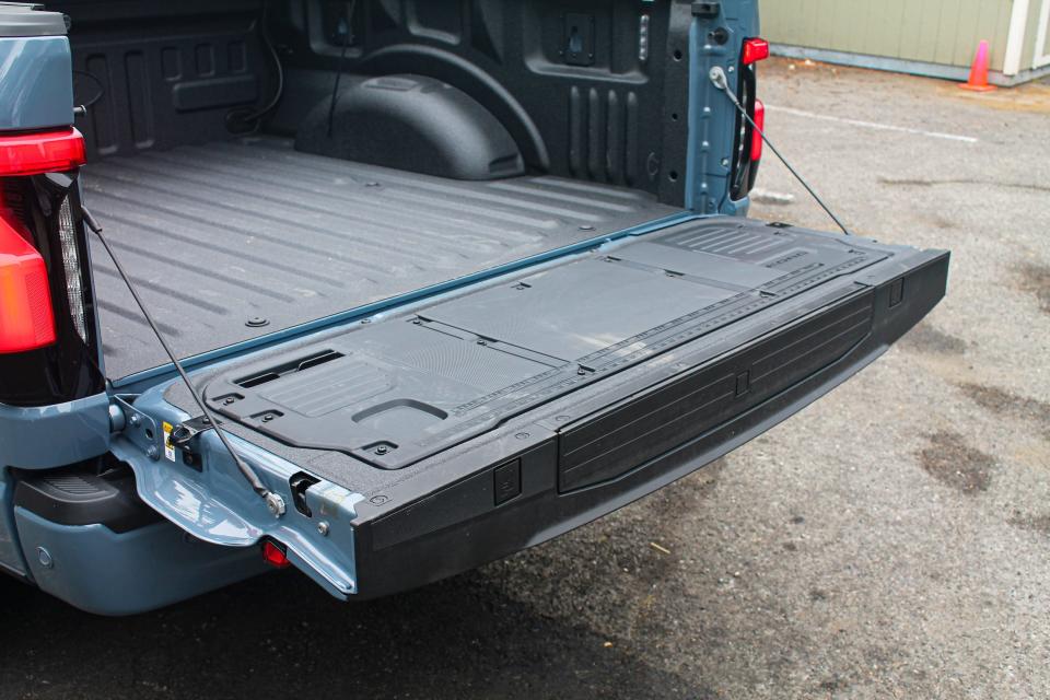 The tailgate open on the 2023 Ford F-150 Lightning Platinum.