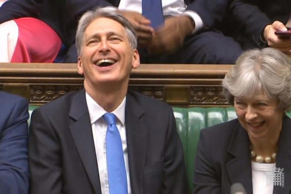 Mr Hammond appeared to be enjoying making the House erupt into laughter. (PA)