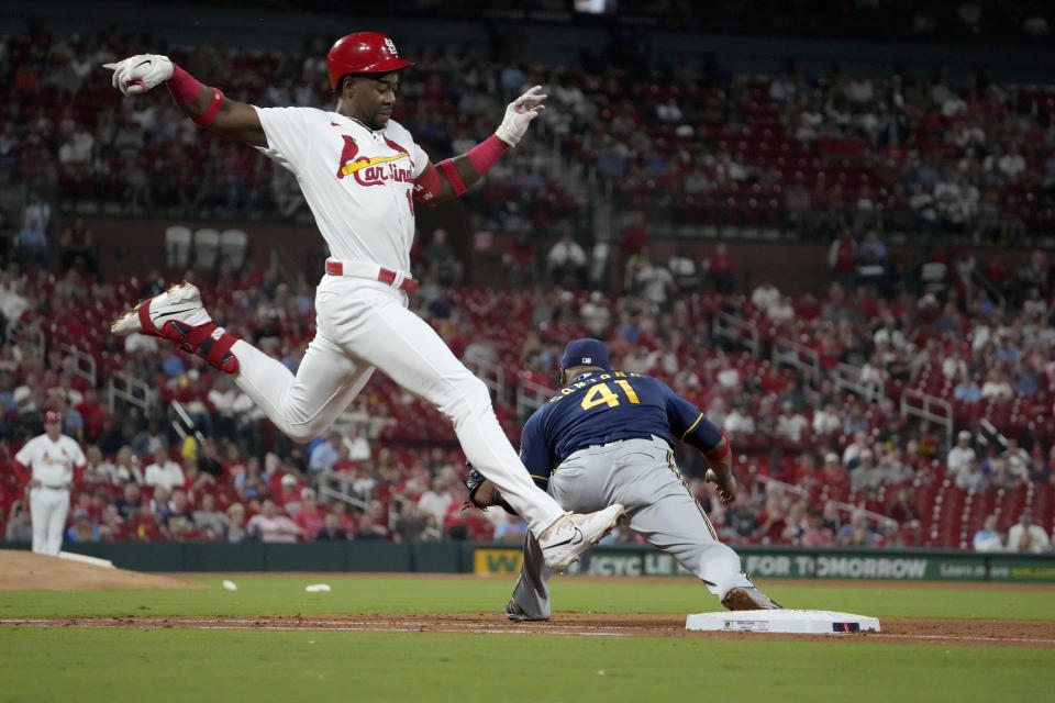 St. Louis Cardinals' Jordan Walker, left, grounds out as Milwaukee Brewers first baseman Carlos Santana (41) handles the throw during the fifth inning of a baseball game Monday, Sept. 18, 2023, in St. Louis. (AP Photo/Jeff Roberson)