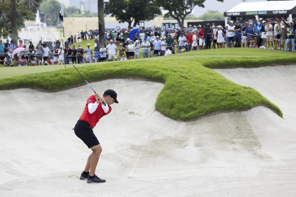 Sergio Garcia hits from a bunker on the 12th hole during the final round of LIV Golf Singapore at Sentosa Golf Club on Sunday, April 30, 2023, on Sentosa Island in Singapore. (Chris Trotman/LIV Golf via AP)