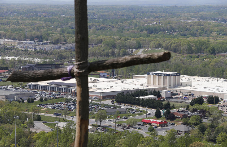 A cross erected on Candlers Mountain overlooks part of Liberty University in Lynchburg, Va., on April 21, 2015.