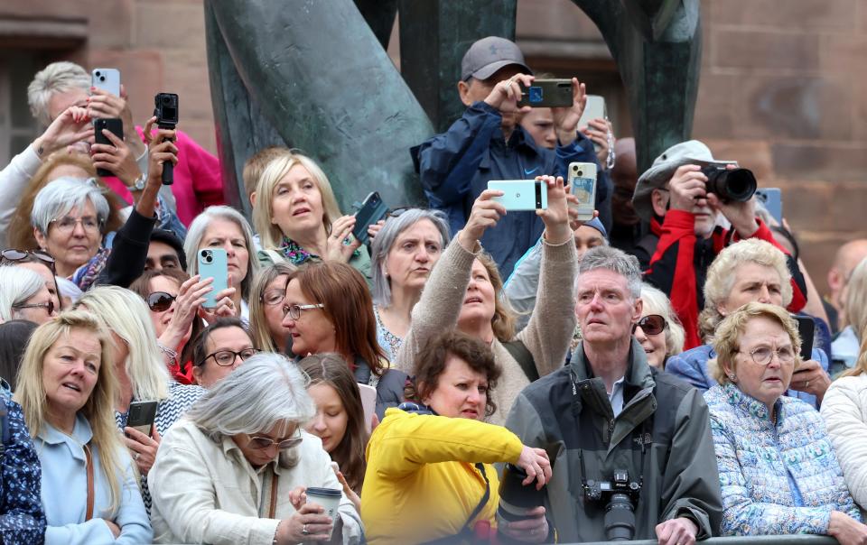 Cameras are at the ready for the arrival of the bride (Getty Images)