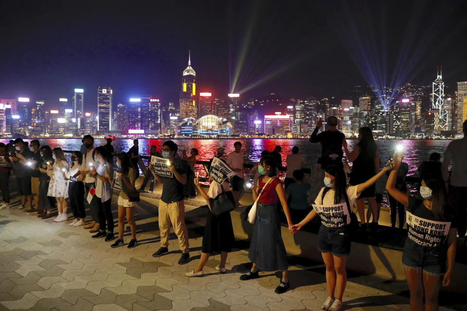 Demonstrators link hands as they gather at the Tsim Sha Tsui waterfront in Hong Kong, Friday, Aug. 23, 2019.&nbsp; (Photo: ASSOCIATED PRESS)