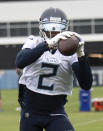 Tennessee Titans wide receiver Julio Jones pulls in a pass during an NFL football practice Thursday, June 10, 2021, in Nashville, Tenn. (George Walker IV/Pool Photo via AP)