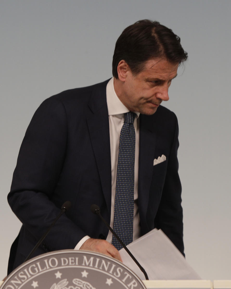 Italian premier Giuseppe Conte leaves after a press conference at Chigi Palace in Rome Thursday evening, Aug. 8, 2019. Italy faced a government crisis Thursday as Interior Minister Matteo Salvini of the right-wing League party called for a new election, saying his party's coalition with the populist 5-Star Movement had collapsed over policy differences. (AP Photo/Alberto Pellaschiar)