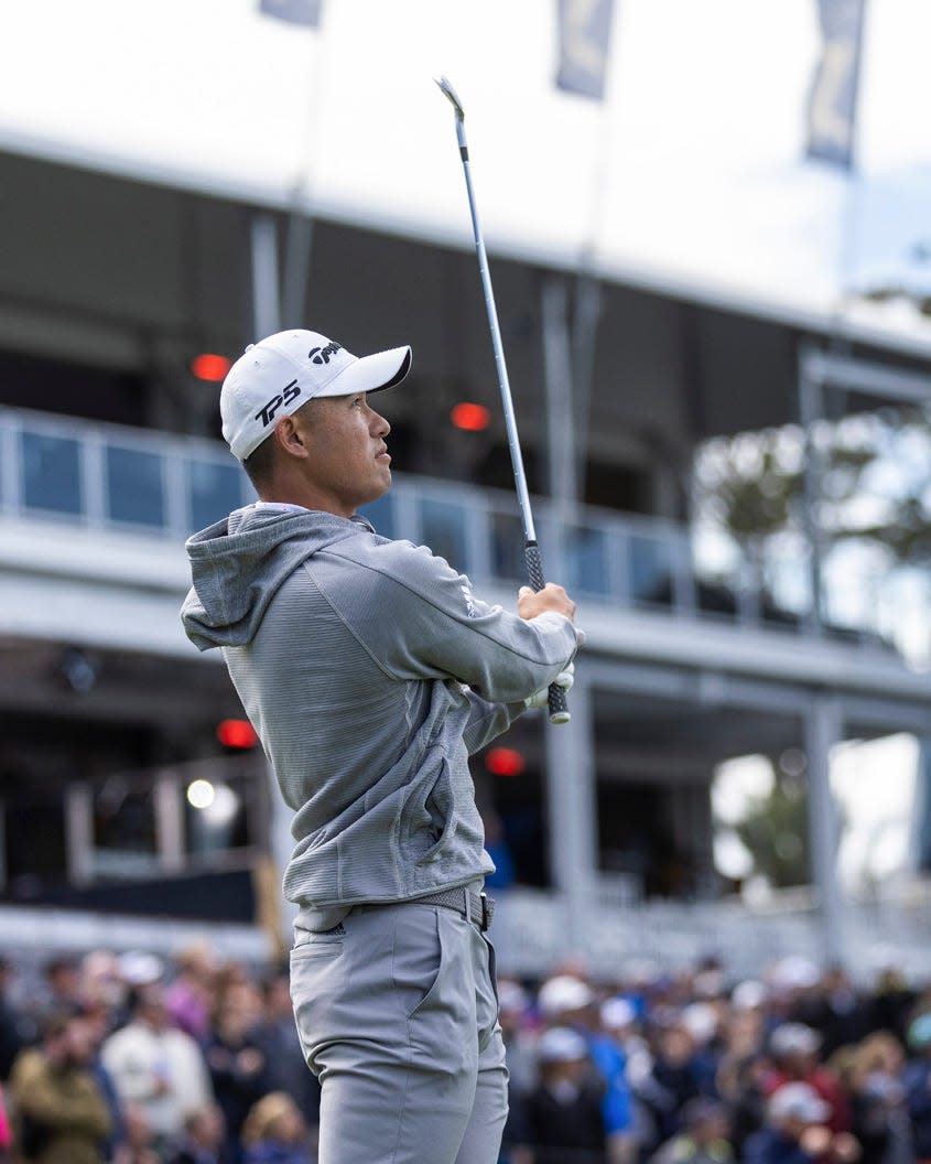 Collin Morikawa watches the flight of his tee shot at the 17th hole of the Players Stadium Course during the 2022 Players Championship.