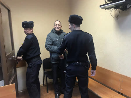 Dennis Christensen, a Jehovah's Witness accused of extremism, leaves after a court session in handcuffs in the town of Oryol, Russia January 14, 2019. REUTERS/Andrew Osborn