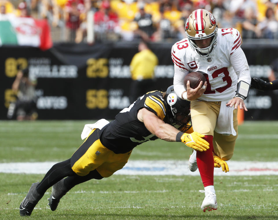 Sep 10, 2023; Pittsburgh, Pennsylvania, USA; San Francisco 49ers quarterback <a class="link " href="https://sports.yahoo.com/nfl/players/34218" data-i13n="sec:content-canvas;subsec:anchor_text;elm:context_link" data-ylk="slk:Brock Purdy;sec:content-canvas;subsec:anchor_text;elm:context_link;itc:0">Brock Purdy</a> (13) runs with the ball against <a class="link " href="https://sports.yahoo.com/nfl/teams/pittsburgh/" data-i13n="sec:content-canvas;subsec:anchor_text;elm:context_link" data-ylk="slk:Pittsburgh Steelers;sec:content-canvas;subsec:anchor_text;elm:context_link;itc:0">Pittsburgh Steelers</a> linebacker <a class="link " href="https://sports.yahoo.com/nfl/players/32005" data-i13n="sec:content-canvas;subsec:anchor_text;elm:context_link" data-ylk="slk:Cole Holcomb;sec:content-canvas;subsec:anchor_text;elm:context_link;itc:0">Cole Holcomb</a> (55) during the fourth quarter at Acrisure Stadium. San Francisco won 30-7. Mandatory Credit: Charles LeClaire-USA TODAY Sports