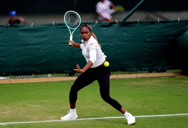 Coco Gauff prepares to hit a forehand while practising at Wimbledon 