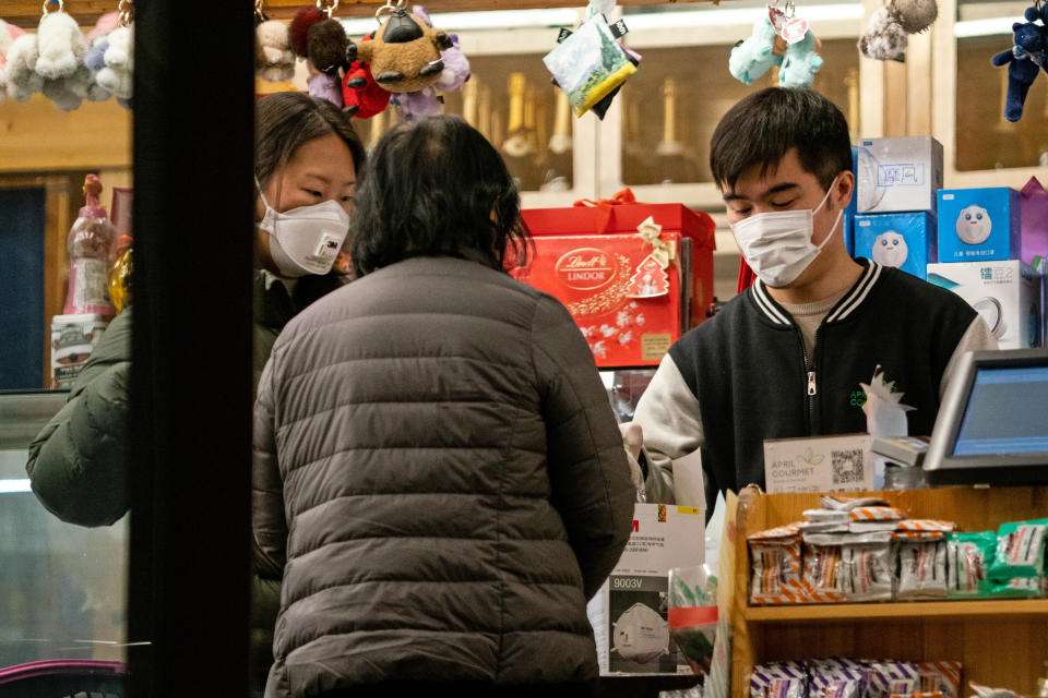 BEIJING, CHINA - FEBRUARY 9, 2020: People in face masks in a shop; since 2019, China has been hit by an outbreak of the 2019-nCoV coronavirus (officially known in China as NCP); as of 9 February 2020, the number of people in China infected with the new coronavirus has risen over 37,000, with the death toll reaching more than 800. Artyom Ivanov/TASS (Photo by Artyom Ivanov\TASS via Getty Images)