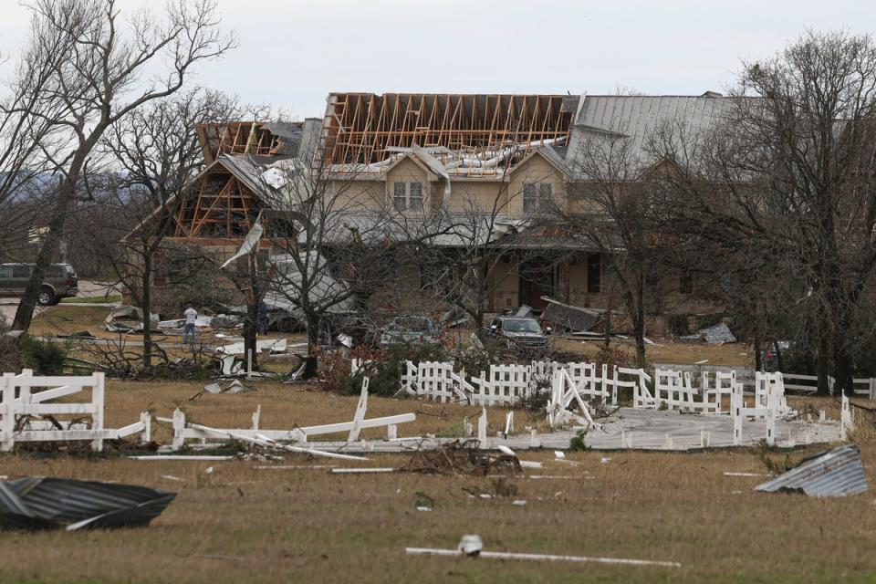 A home after a tornado swept through near Decatur, Texas on 13 December (AP)