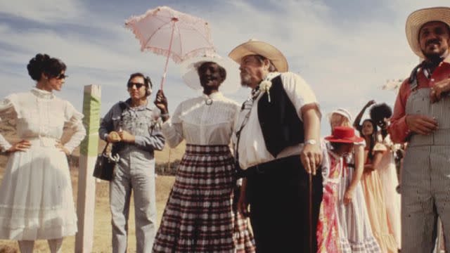 <p>Bruce Levine/Courtesy of Paramount+</p> Synanon founder Chuck Dederich and his wife Betty at a Western wedding in Born in Synanon