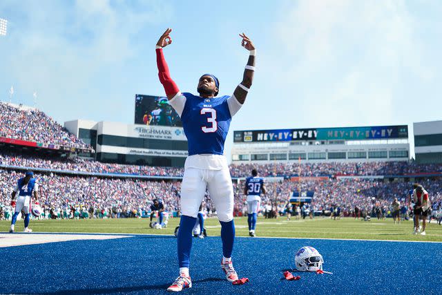 <p>AP Photo/Adrian Kraus</p> Damar Hamlin raises his arms while warming up prior to an NFL football game against the Miami Dolphins, Sunday, Oct. 1, 2023