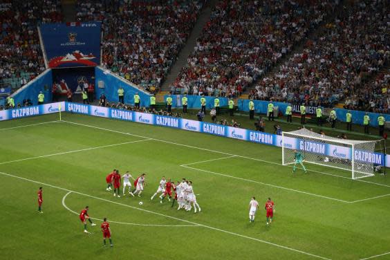 Ronaldo curls home Portugal's third goal against Spain (Getty )